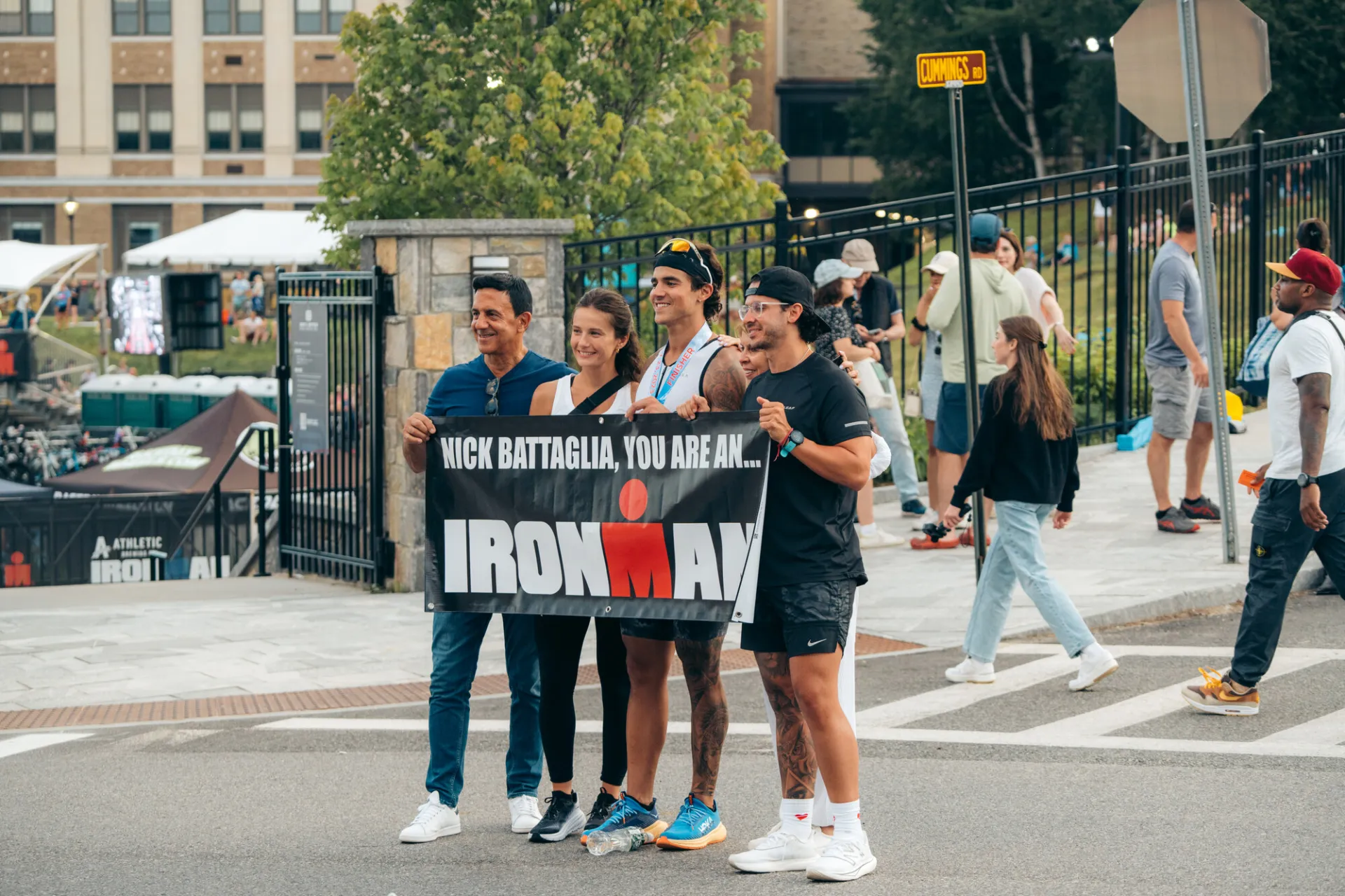 Family celebrates Ironman athlete finish with banner