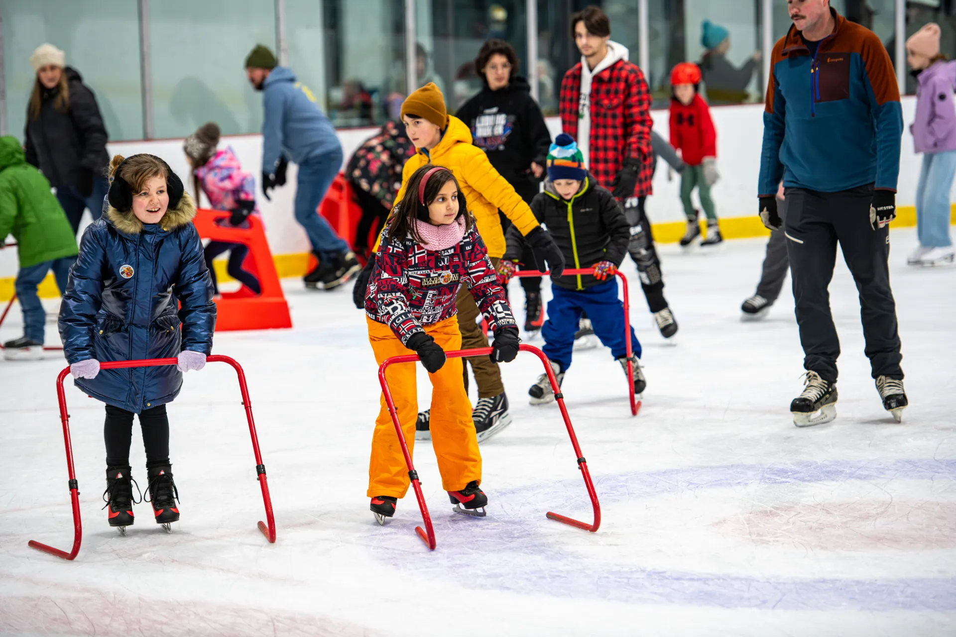 Kids skating at a civic center