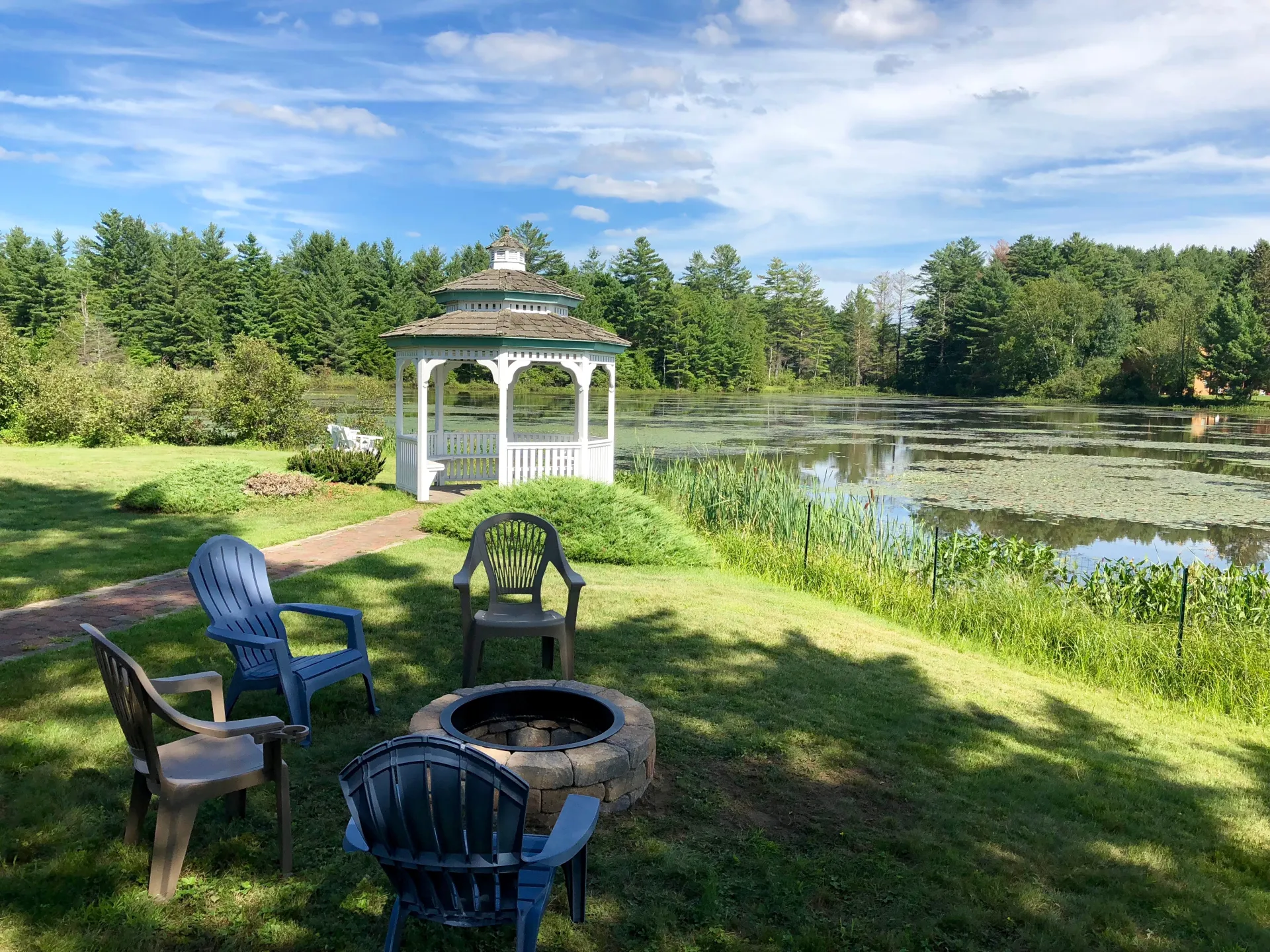 The white gazebo by the water at Sara Placid Inn & Suites.