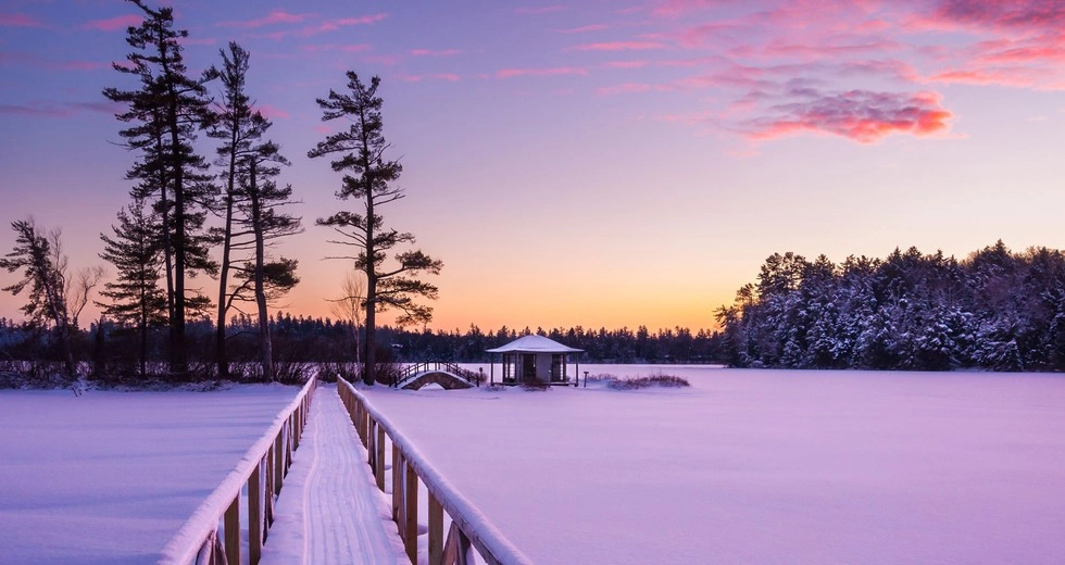 A winter sunset turns the vista purple at White Pine Camp.