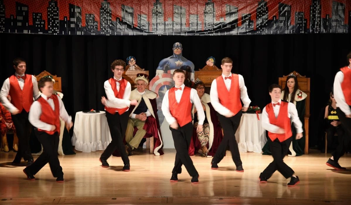 Costumed dancers on stage