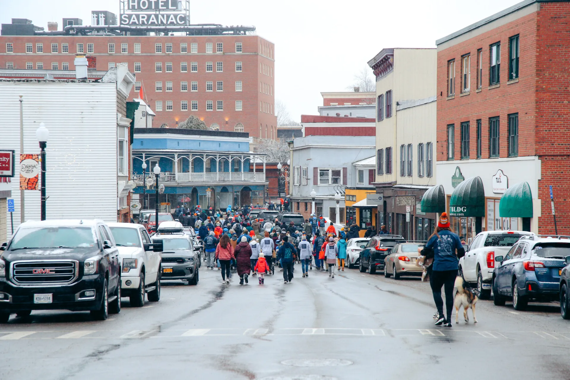 group of runners on main street moving away from camera 