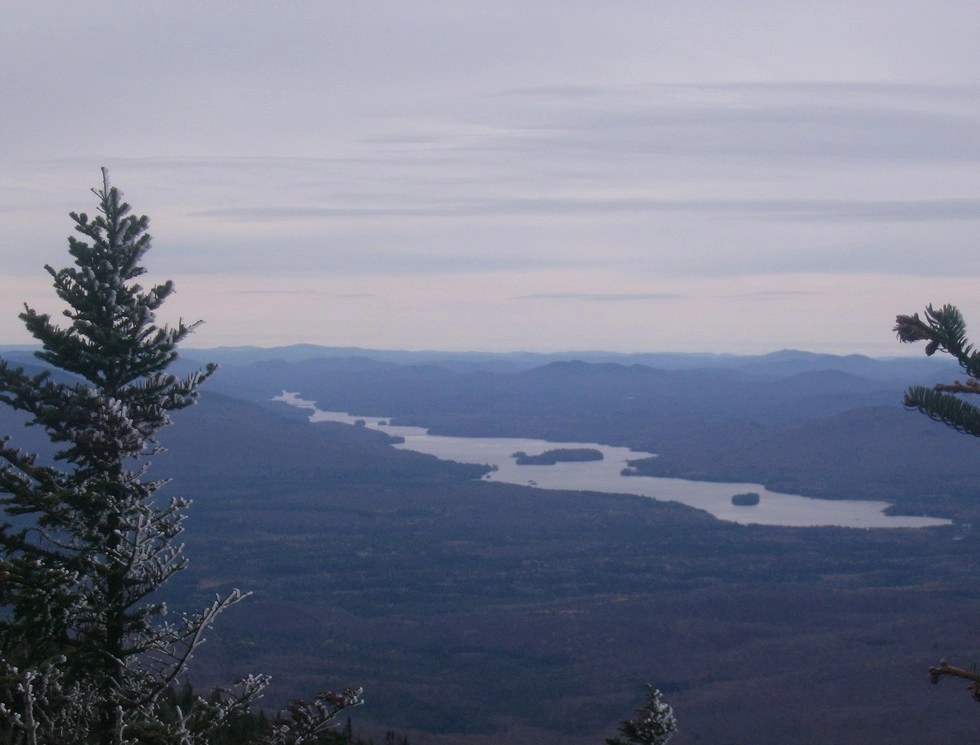 The view of a long lake from the mountains