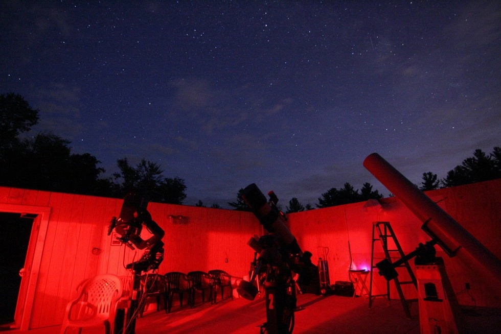 Astronomy equipment glowing with red light