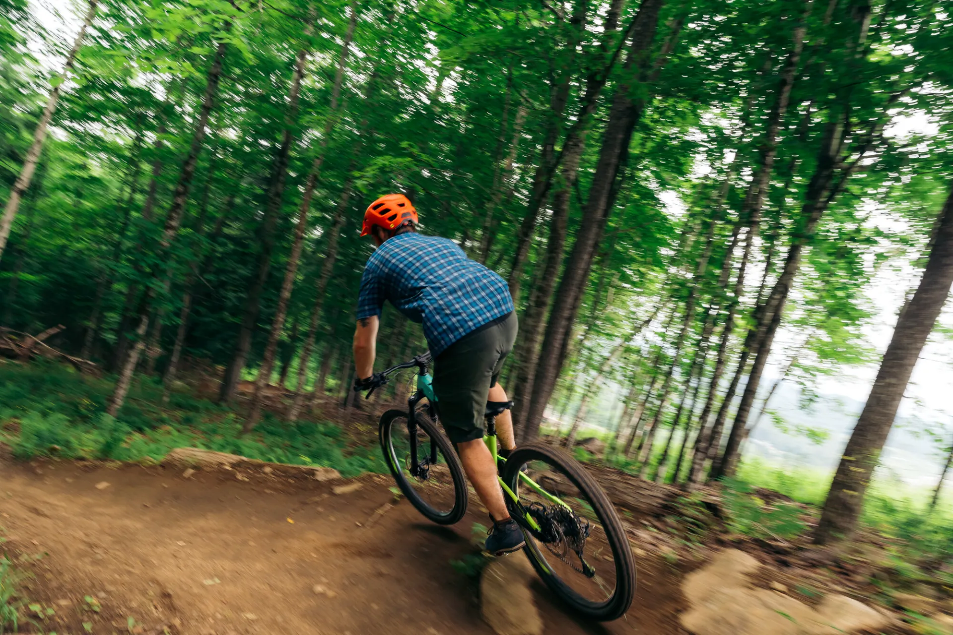 A mountain biker hits a berm