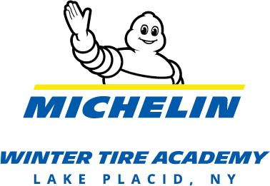 Logo that includes Michelin man waving above the words Michelin Winter Tire Academy Lake Placid, NY