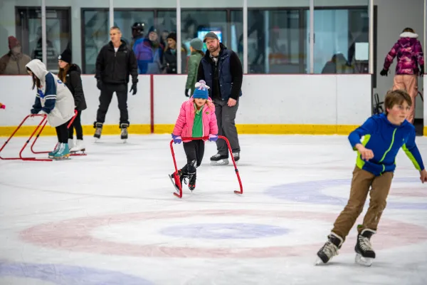 Kids skating with their parents