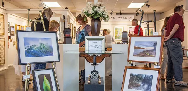Framed art on easels in the entry