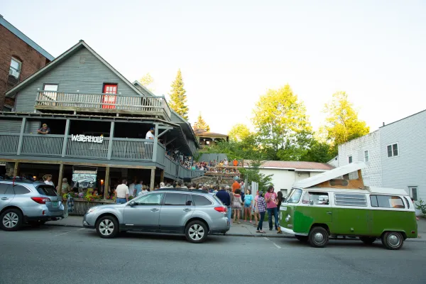 Cars and people lined up in front of The Waterhole.
