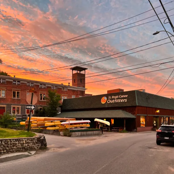 Gorgeous pink and orange sunset over St Regis Canoe Outfitters shop.