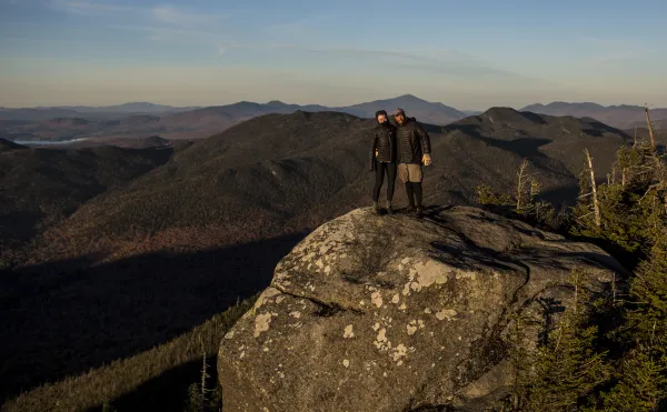 Two people on the summit of Seymour