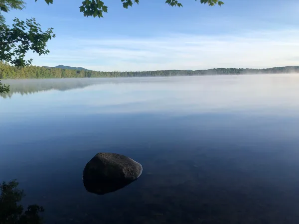 The smooth as glass waters of Lake Clear
