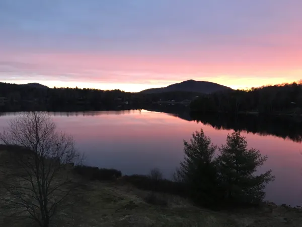 A glorious sunset over the lake and mountains.