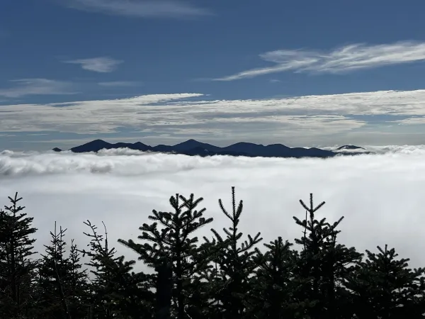 Mountains peek out from the clouds