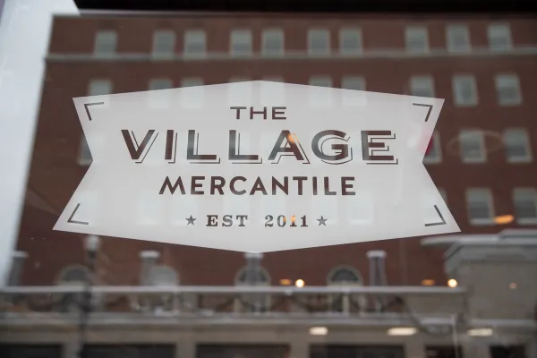 The sign for The Village Mercantile