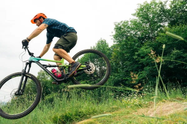 A mountain biker gets air