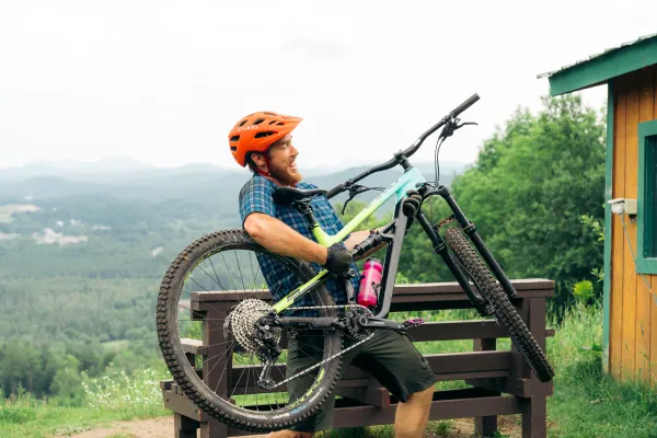 A mountain biker uses his bike as a guitar