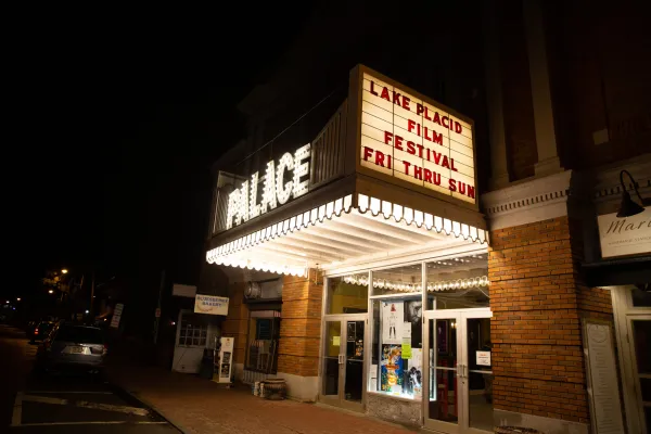 The Palace in Lake Placid lit up at night.