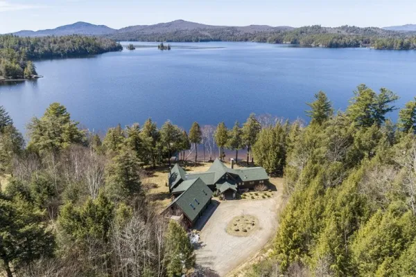 An aerial view of Alpenglow Lakeside Lodge showing the prominence of the building and the proximity to the water.