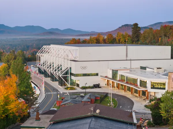 Olympic Center building where hockey rinks are located seen from aerial exterior in fall