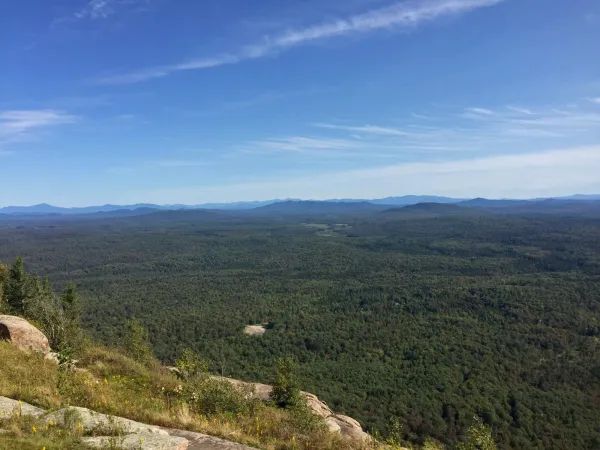 The view of a plain and distant mountains from Azure.