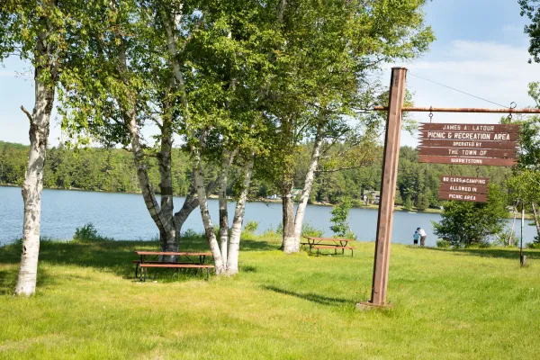 The wooden sign for Latour Park