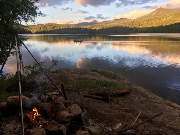 A campfire by the water