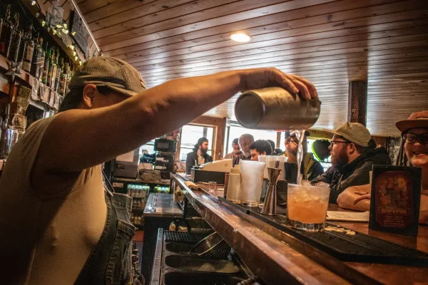 Person pouring a drink