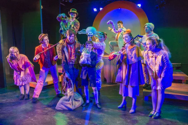 Colorful characters illuminated on stage