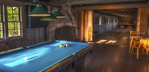 A pool table set to play.