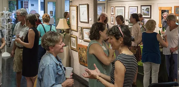 People mingle in the gallery