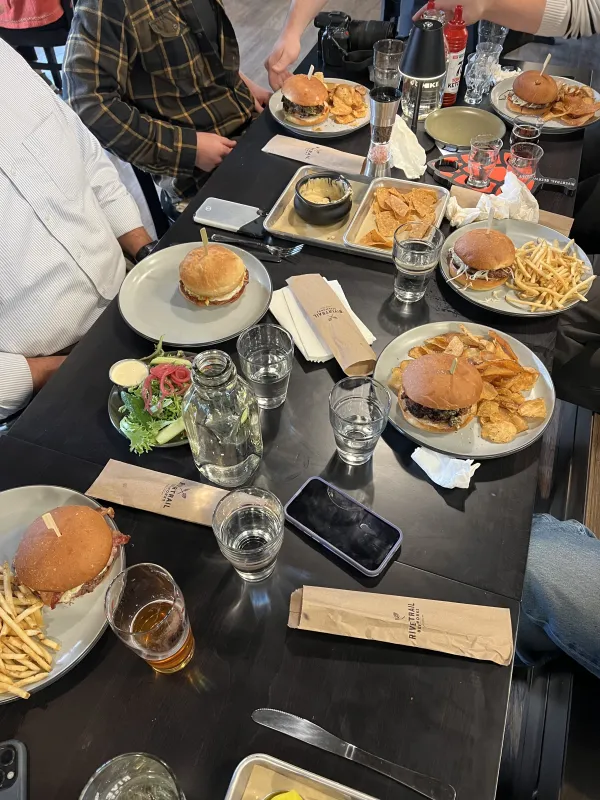 Assorted meals shared among friends at Rivertrail Beerworks