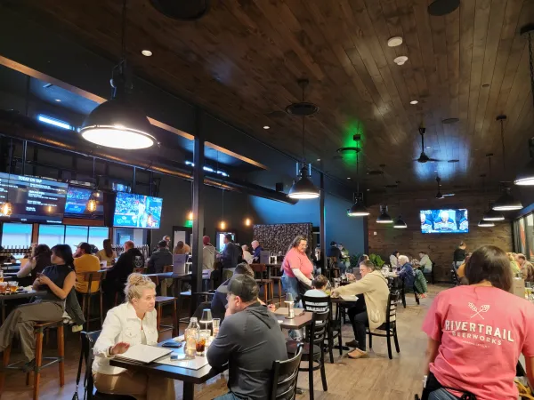 Dining space filled with patrons at Rivertrail Beerworks