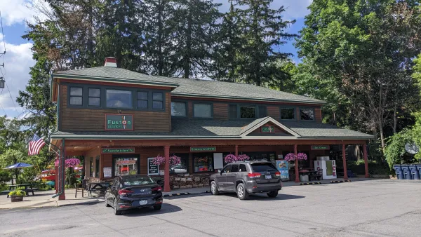 The exterior of the shop in summer time.