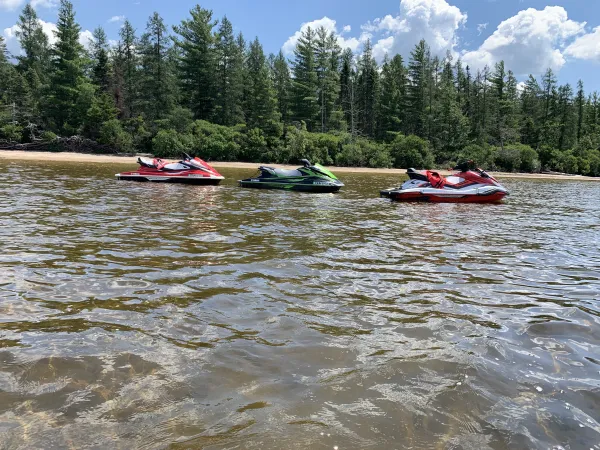Unaccompanied jet skis in the water.