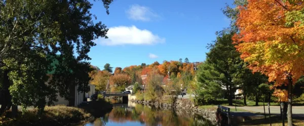 Saranac Lake Riverwalk with fall foliage on dislplay