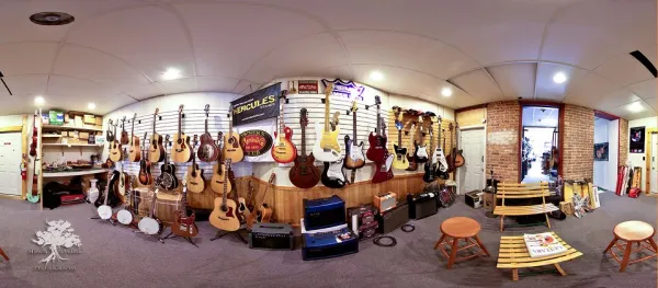 A panorama view of all the guitars and other musical instruments in the shop