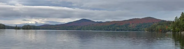 A lake with mountains in the background.