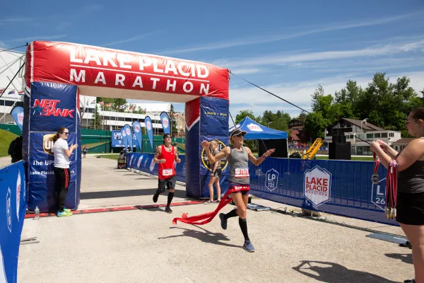 Runner crosses the finish line of the Lake Placid Marathon