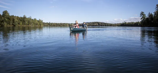 A couple people in a canoe