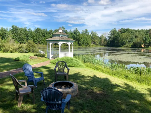 The white gazebo by the water at Sara Placid Inn & Suites.
