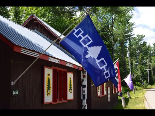 A blue flag hangs outside.