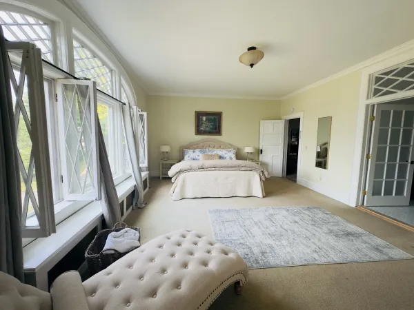 Huge bright room with massive windows and transoms allowing ample light