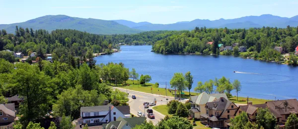 An aerial view of the lake surrounded by mountains.