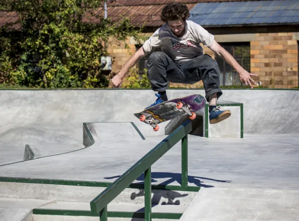 male skater hits a rail 