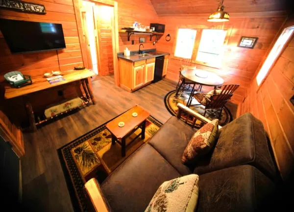 Open living space with dining area and kitchenette at Rockledge Cabins & Retreats 