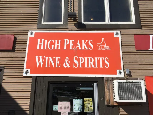 Red sign for the High Peaks Wine & Spirits.