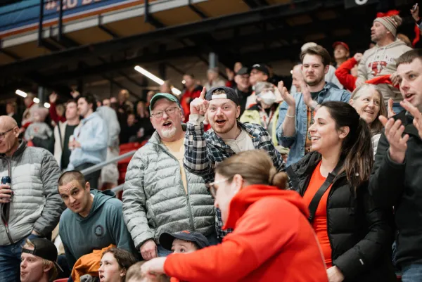 Fans in lower bowl of 1980 Herb Brooks Arena cheer at an ECAC Men's Hockey Championship game