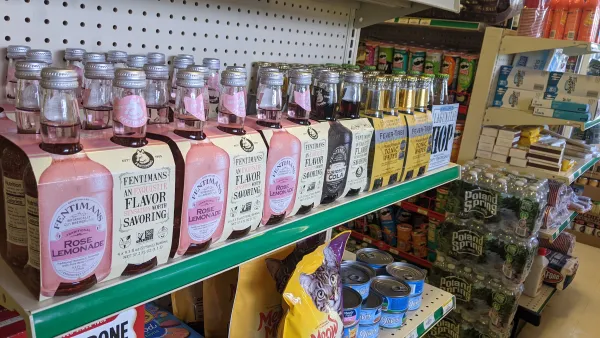 Mixed drink supplies and pet food on a shelf.