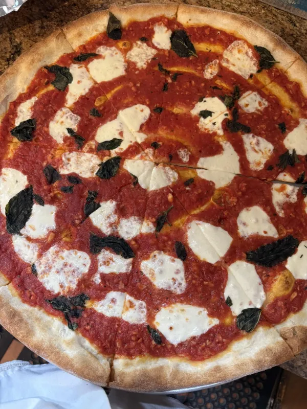 A Margarita pizza with fresh mozzarella from Little Italy Saranac Lake